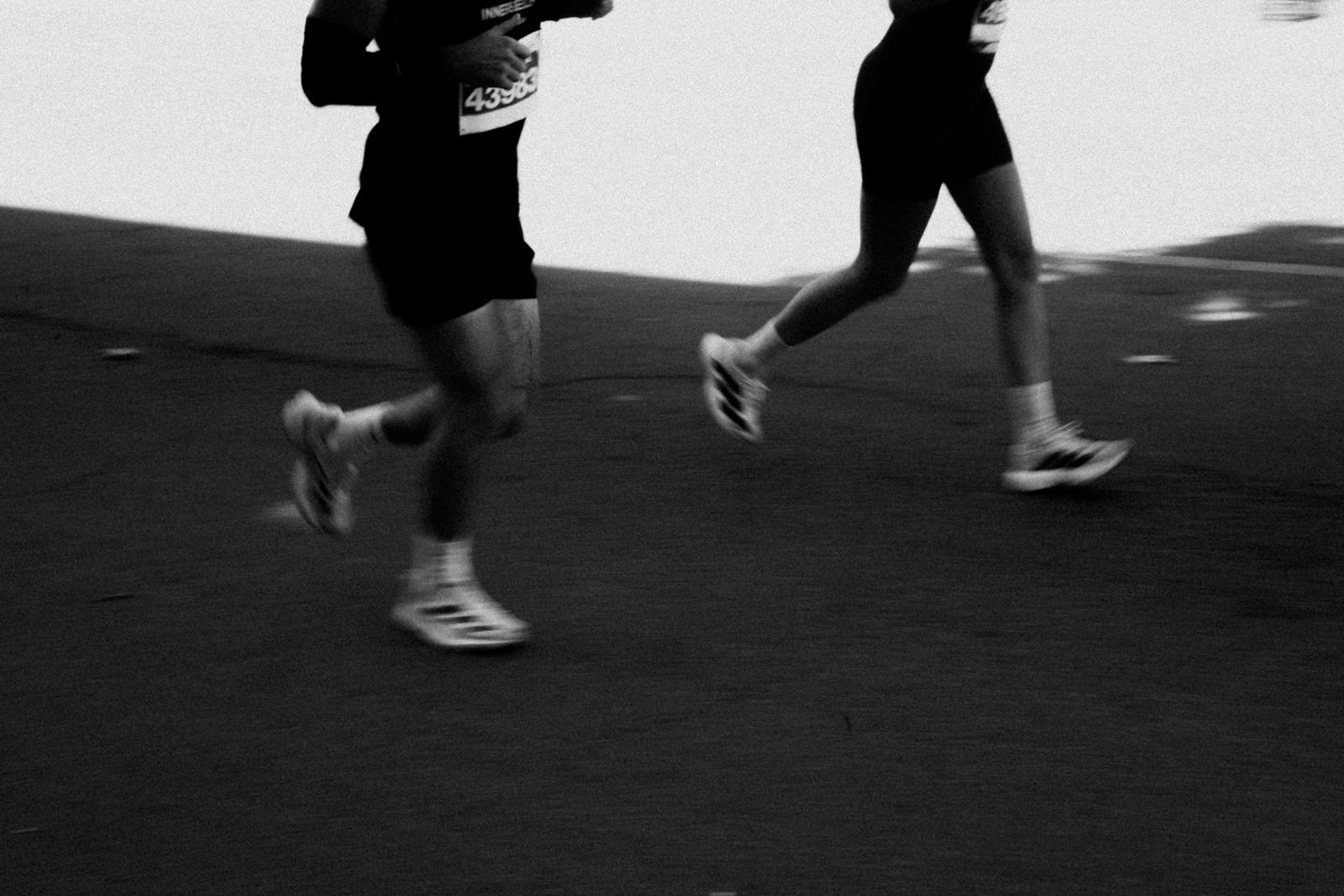 Two people running together