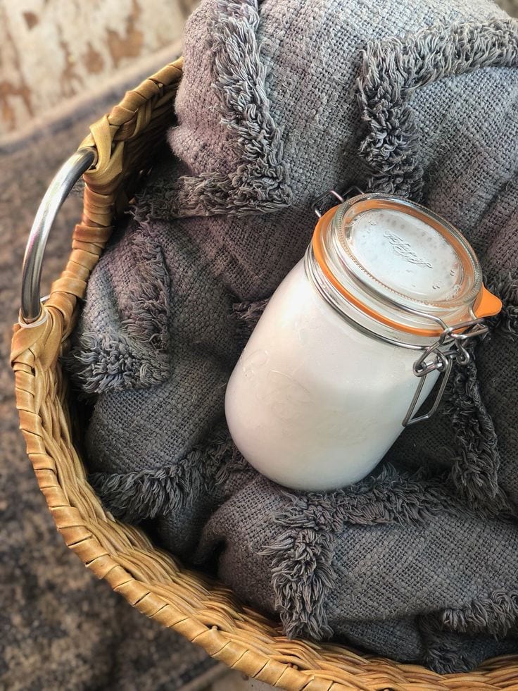 A jar of homemade powdered laundry detergent